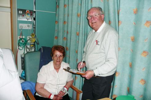 Radio Therapy Presenter John Savage collects a request from Ms Ellen Hughes of Parkstone, in the short-stay ward of the Eye Unit