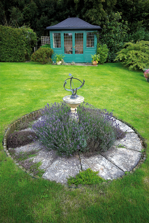 DAIRY HOUSE Lavender surrounds a small sundial