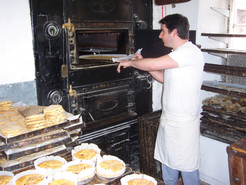 910edTaste1 Steven Oxford puts another batch of flapjacks into the venerable oven at the bakery in Alweston