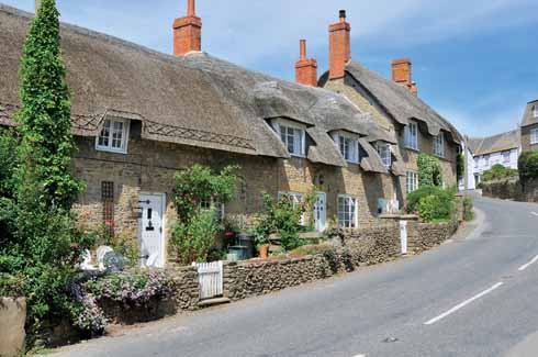 1010edBurton3 According to Treves: ‘The village is exceedingly pretty, possessing many delightful old houses and cottages with thatched roofs.’ This once accurate description is today less appropriate thanks to some undistinguished new building, and to the number of static caravans in the area.