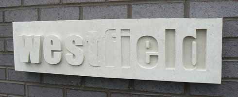 1110edLives3 This sign for Westfield Technology College, Weymouth, is Portland stone and is an example of raised and sunken lettering