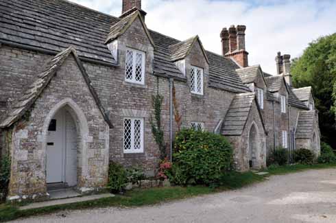 111edAyres6 The village is mainly composed of Purbeck stone-built Victorian cottages, but there is a wonderful array of architecture from the plain to the near frivolous. These estate cottages have ornate diamond (as apposed to square) profile chimneys.