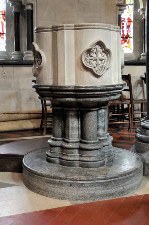 111edAyres7 The font inside the church is made from a combination of Purbeck stone and Purbeck marble, as are the columns that support the church itself