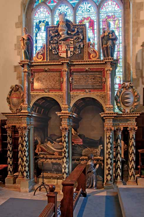 211edWimbStGiles4 Effigies of Sir Anthony Ashley and his wife rest serenely in their rather gaudy, but nonetheless magnificent, monument. Their daughter kneels nearby in eternal vigil.