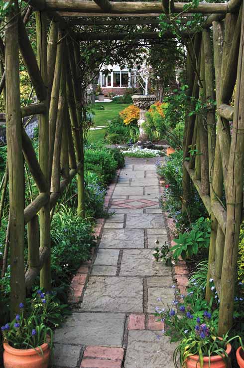 311edGarden6 A rustic pergola links different areas