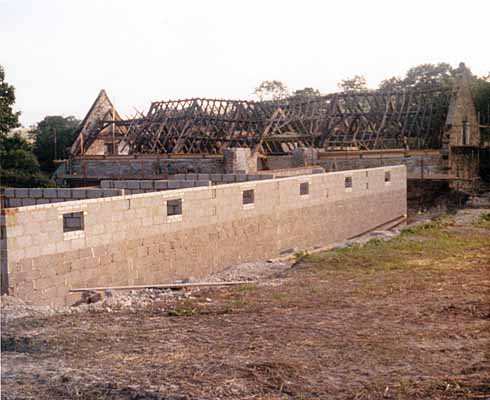511edCerne3 North Barn's roof timbers revealed, with the controversial building work in the foreground