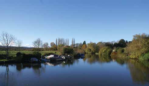 A less-often seen view of the Frome from South Bridge in Wareham, looking westwards rather than the more familiar view towards the Quay