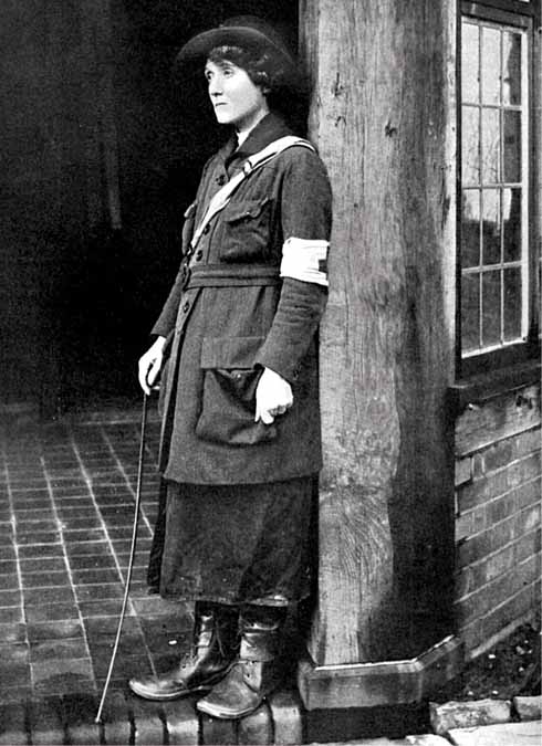 Mabel St Clair Stobart in around 1916. She wears her uniform of heavy jacket with a Red Cross armband, long split skirt, and stout boots.