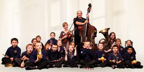 Andy Baker with the children of Heathlands School, which has benefited from BSO Blast, the Orchestra’s music-making project that takes music into schools