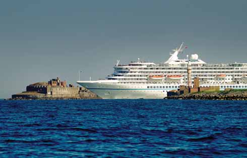 The 44,000 tonne cruise ship Artania leaving Portland Harbour for Weymouth Bay; Portland is becoming an increasingly popular destination for cruise ships