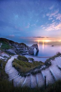 The lights of the Isle of Portland shine out as night falls at Durdle Door. Neither this shot nor the one below really looks as if it was taken at night