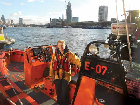 Holly on board an E-class boat at Victoria Embankment on the Thames with (right to left) the LWT building, Southbank Tower, Shard, Walkie Talkie, Cheese-Grater and Gherkin beyond
