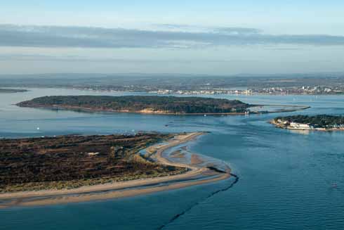 The eastern end of the 630-mile South West Coast Path is at South Haven point, just before the Sandbanks ferry on Studland. Opposite it is Sandbanks, while Brownsea Island and Poole Harbour sit behind the narrow crossing point.
