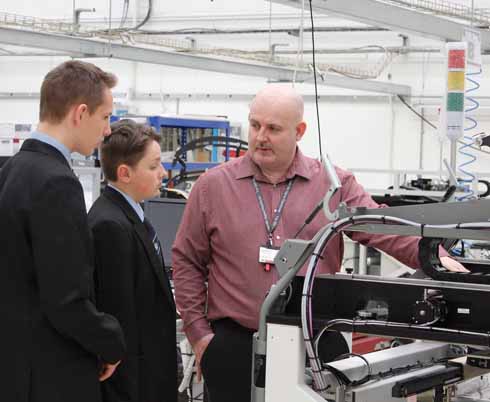 Students from Wey Valley School who are interested in pursuing careers in engineering on a site visit to ASM in Weymouth with one of the firm’s managers who acts as a mentor