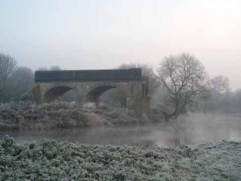The brick pier of one of the two remaining flood arches of Blandford Forum rail bridge over the Stour