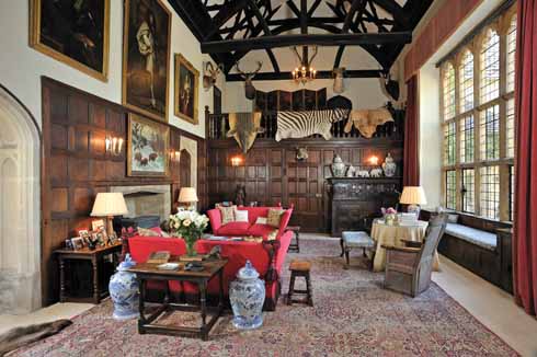 The Great Hall, with part of the magnificent roof, the panelling beyond which screens the passage, and the great window in the west wall, installed by Lady Victoria Herbert