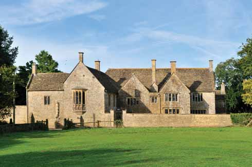 This view of the house from the east, across the lane running through the village, shows the position of the oriel window