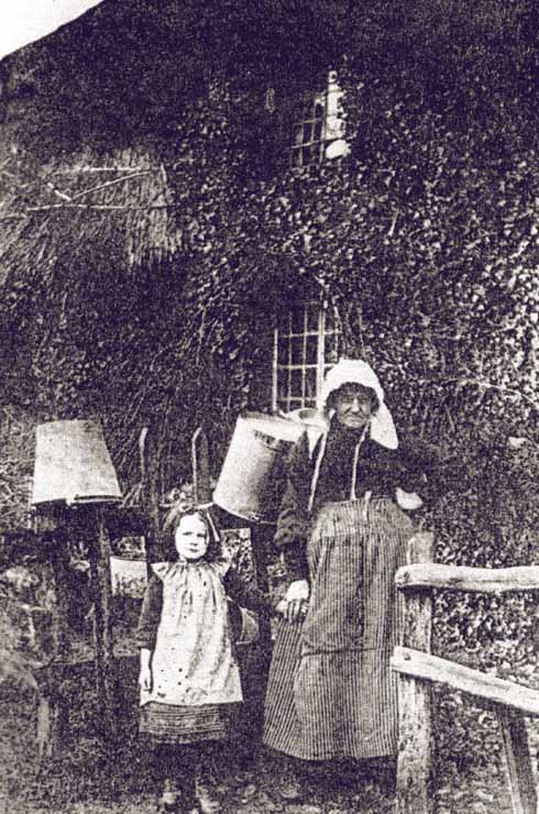 oorer members of the community lived in small houses with large plots of land for growing vegetables, keeping poultry and perhaps a pig. Although these cottages have disappeared, their locations are mapped and can be seen from the lanes. This photograph shows Mrs Cleall in 1881. Her cottage was at the bottom of Mount Pleasant Lane. The bend in Kingcombe Lane is known locally as Cleall’s corner.