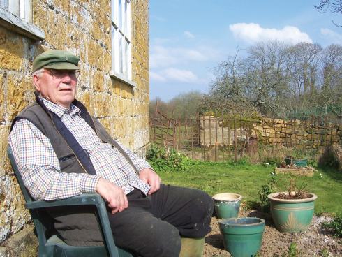 Lives 3 Les relaxes outside the farmhouse he has lived in for over fifty years